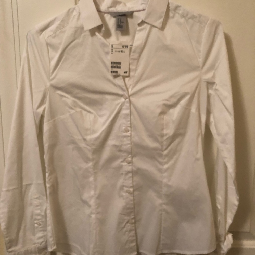 White long sleeved tapered cotton shirt.